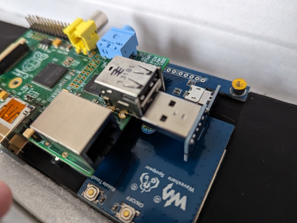 The Pi mounted to the screen, showing the USB connector not lined up
